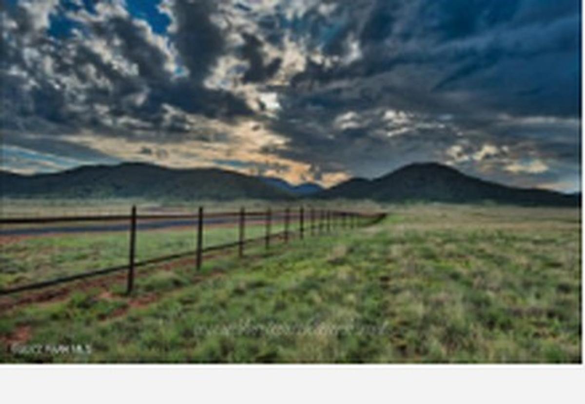 Storm light over the grasslands and mountains at Ventura Ranch